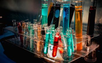 Colorful test tubes filled with liquids in a laboratory setting.