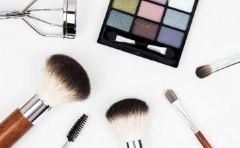 Top view of makeup tools and a colorful eyeshadow palette arranged artistically. — Womens Cotton Nightgowns in Beautiful Shad