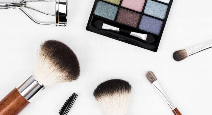 Top view of makeup tools and a colorful eyeshadow palette arranged artistically. — Womens Cotton Nightgowns in Beautiful Shad