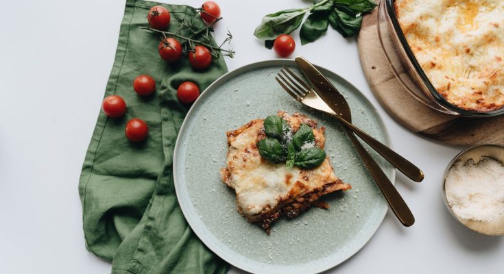 Savor the rich flavors of homemade Italian lasagna with fresh basil and tomatoes. — Your Canine's Food Might Be Causing His S
